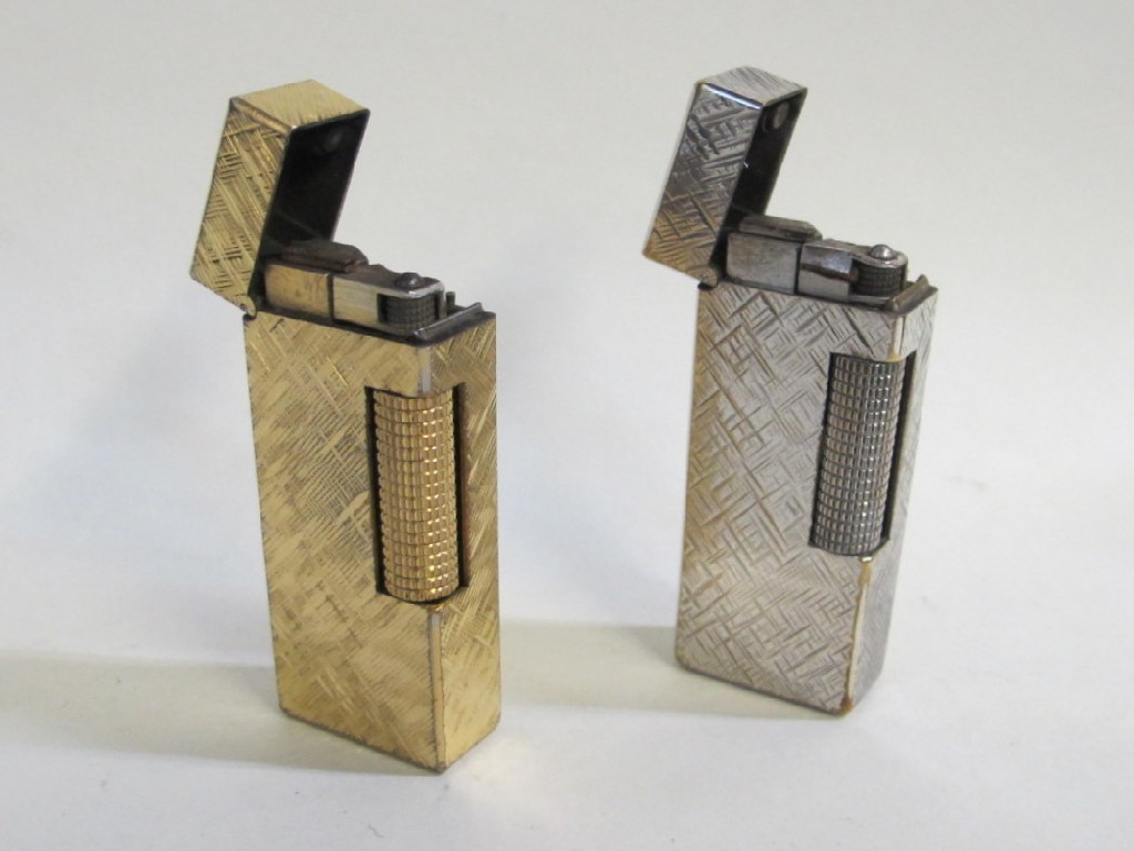 Appraisal: Lot comprising two cased Dunhill cigarette lighters