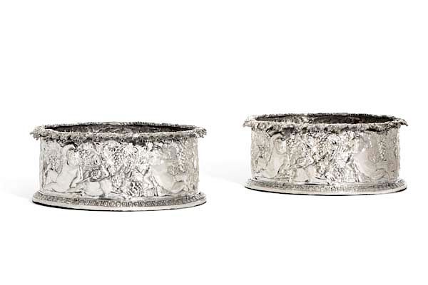 Appraisal: A pair of sterling silver magnum wine coasters A pair