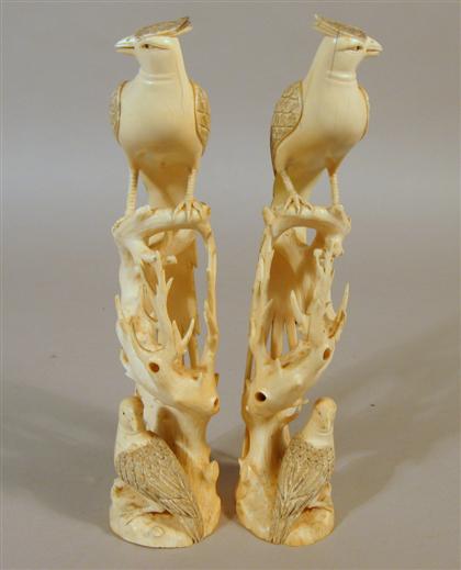 Appraisal: Pair of Chinese elephant ivory phoenix Of tall open-work carving