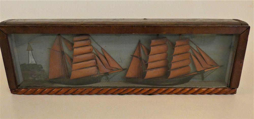 Appraisal: WOOD DIORAMA OF SHIPS Antique small carved wood diorama cased