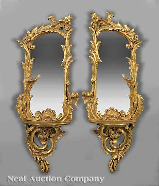 Appraisal: A Pair of Italian Carved and Gilt Mirrored Bracket Shelves