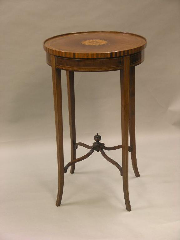 Appraisal: An Edwardian inlaid circular mahogany occasional table the top with