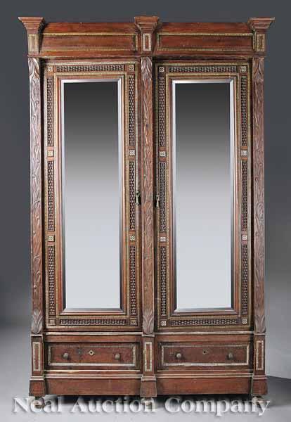 Appraisal: An Antique Moroccan Carved Cedar Mother-of-Pearl and Bone Inlaid Armoire