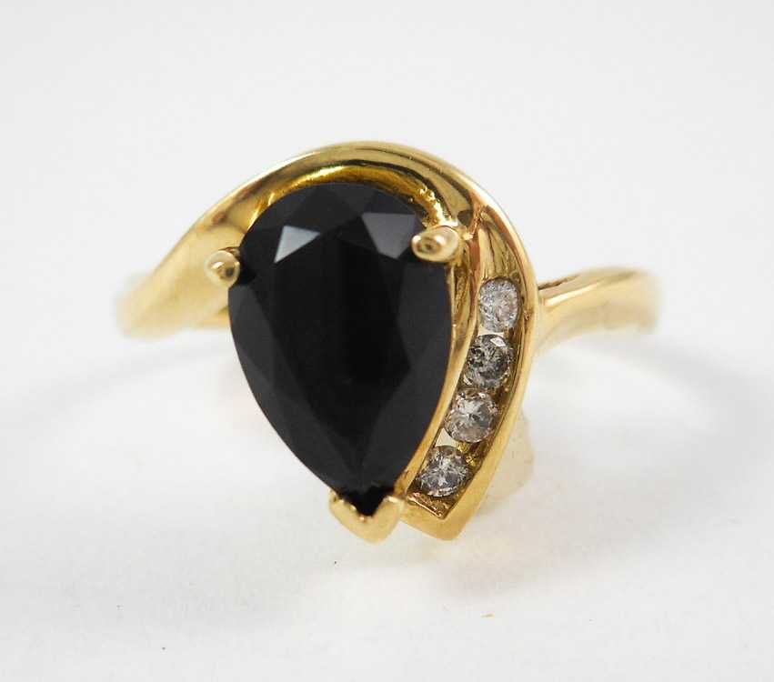 Appraisal: BLACK ONYX DIAMOND AND TEN KARAT GOLD RING with four