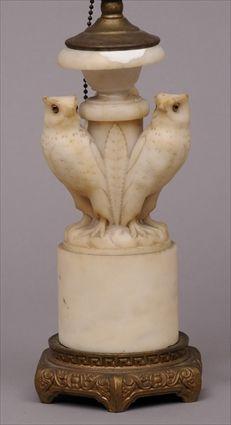 Appraisal: CARVED ALABASTER CANDLESTICK WITH OWL FIGURES MOUNTED AS A LAMP