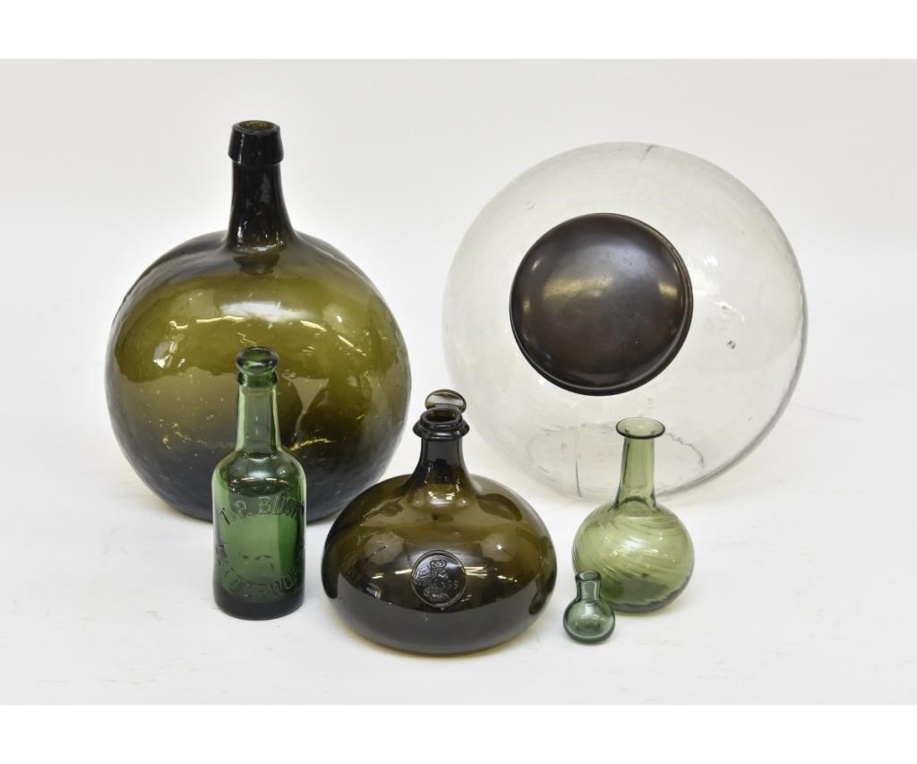 Appraisal: Green molded glass bottle h together with blown glass a