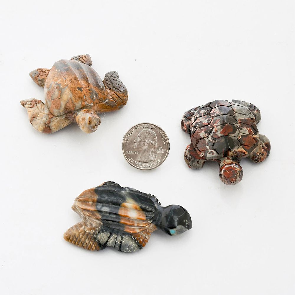 Appraisal: THREE HANDCARVED PRECIOUS STONE FETISH TURTLE FIGURES Small multitone designs