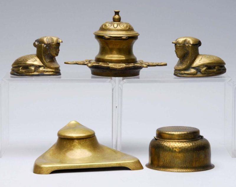 Appraisal: Lot of Brass Tinted Inkwells Description All inkwells include lids