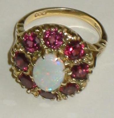 Appraisal: A PINK TOURMALINE AND OPAL CLUSTER RING the central oval