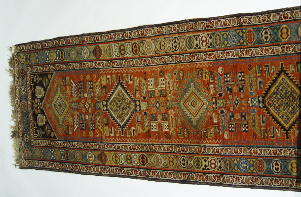 Appraisal: Iranian rectangular carpet decorated with a predominantly red and blue