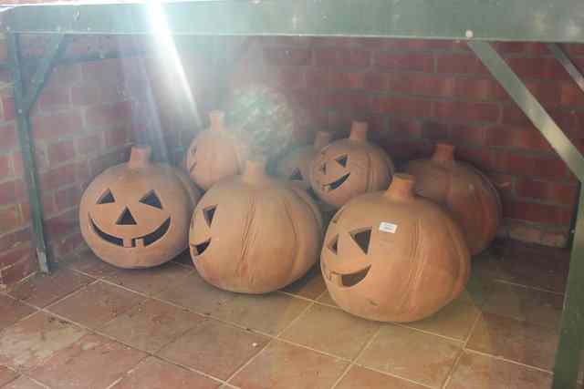 Appraisal: A GROUP OF VARIOUS TERRACOTTA HALLOWEEN DECORATIONS in the form