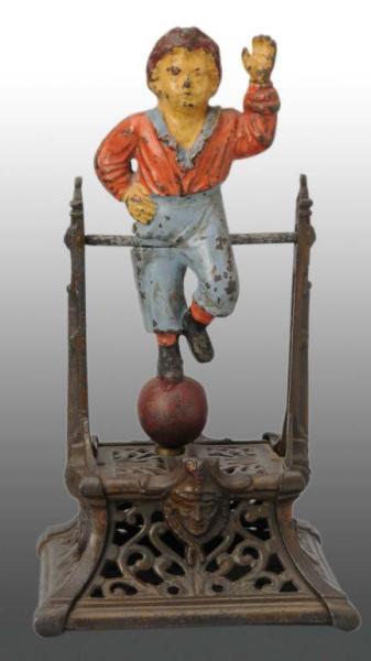 Appraisal: Cast Iron Boy on Trapeze Mechanical Bank Description Manufactured by