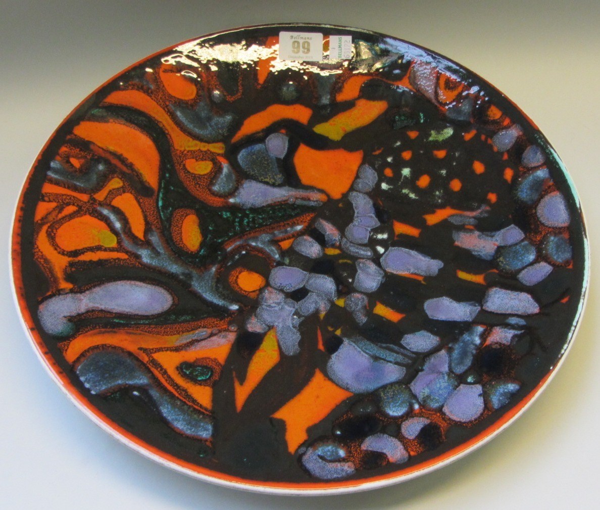 Appraisal: A Poole pottery charger decorated with mottled shapes against a