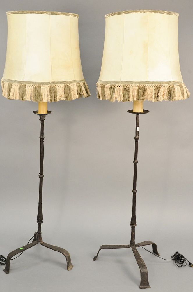 Appraisal: Pair of iron candlestick style floor lamps with faux candle