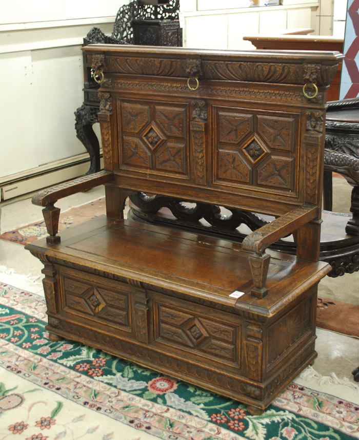 Appraisal: CARVED OAK SETTLE WITH LIFT SEAT English th century having