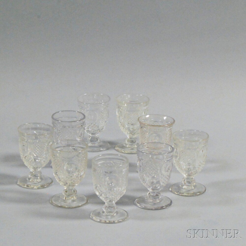 Appraisal: Set of Nine Colorless Pattern Glass Horn of Plenty Wines