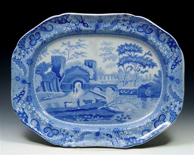 Appraisal: A SPODE BLUE AND WHITE MEAT PLATE decorated figures entering