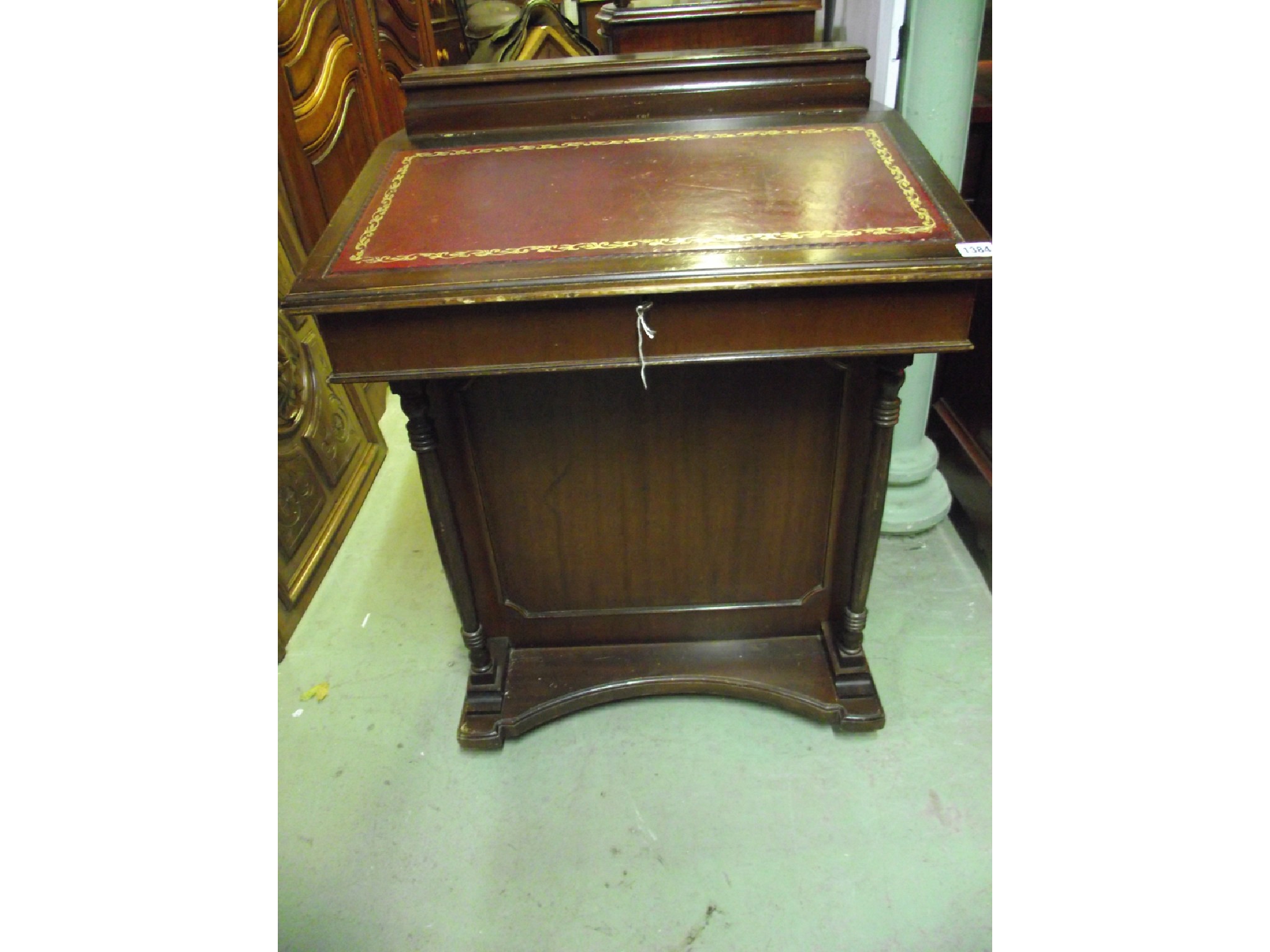 Appraisal: A reproduction mahogany davenport in the Victorian style with hinged