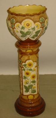 Appraisal: A BURMANTOFTS FAIENCE JARDINERE on stand the jardiniere of bellied