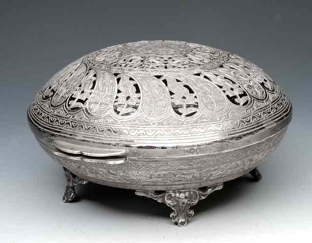 Appraisal: AN INDIAN PIERCED WHITE METAL probably silver oval box with