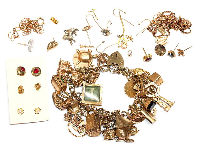 Appraisal: A CT GOLD BRACELET with attached charms with gold chains