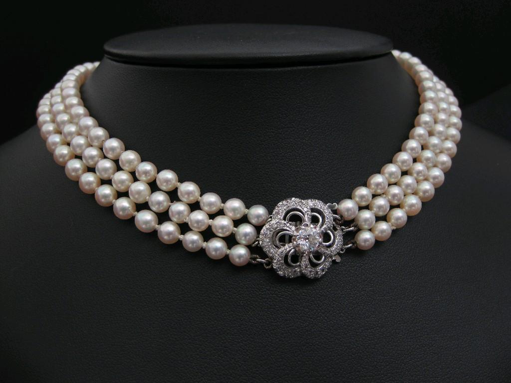 Appraisal: A triple row graduated Cultured Pearl Necklace on diamond clasp