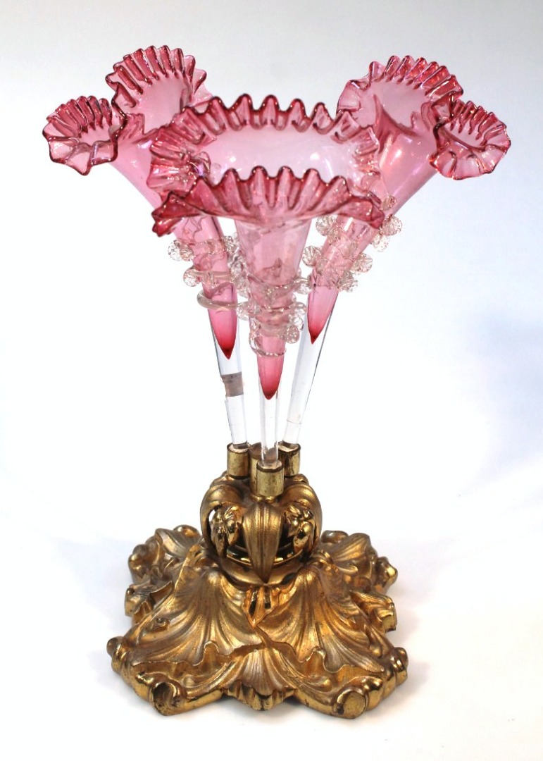 Appraisal: An early thC cranberry and clear glass three branch epergne