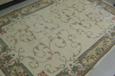 Appraisal: HAND KNOTTED ORIENTAL CARPET Indo-French the ivory field lightly decorated