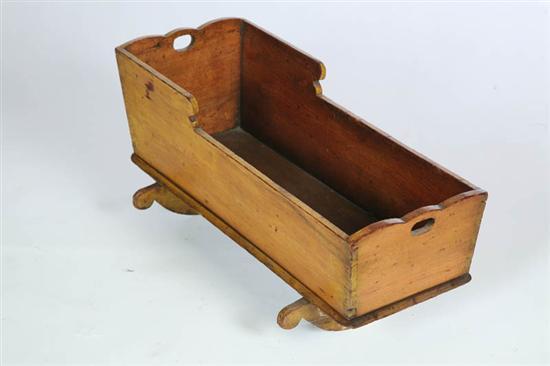 Appraisal: DOLL CRADLE American late th century butternut and poplar Old