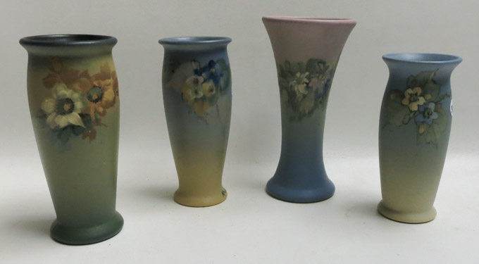 Appraisal: FOUR WELLER ART POTTERY VASES in various floral patterns one