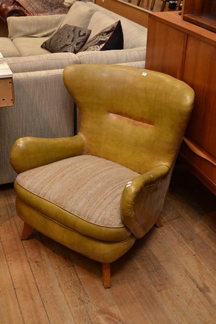 Appraisal: TWO 'S ARMCHAIRS INCLUDING A WINGBACK CHAIR IN MUSTARD VINYL