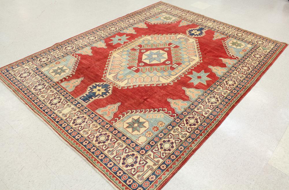 Appraisal: HAND KNOTTED ORIENTAL CARPET Pakistani Caucasian geometric design on plain