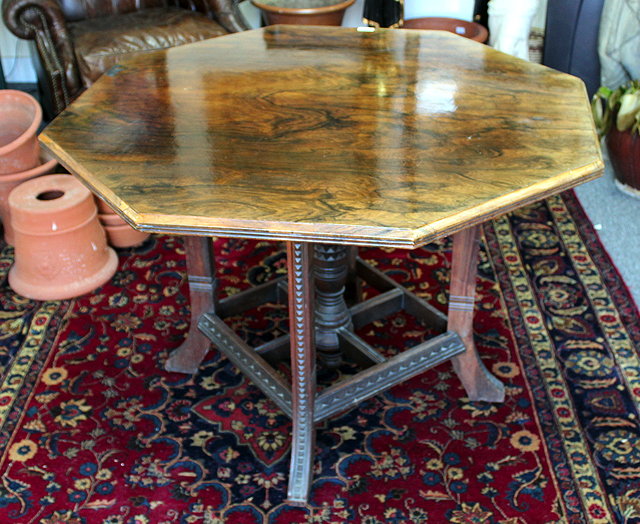 Appraisal: A LATE VICTORIAN ROSEWOOD CENTRE TABLE the octagonal top over