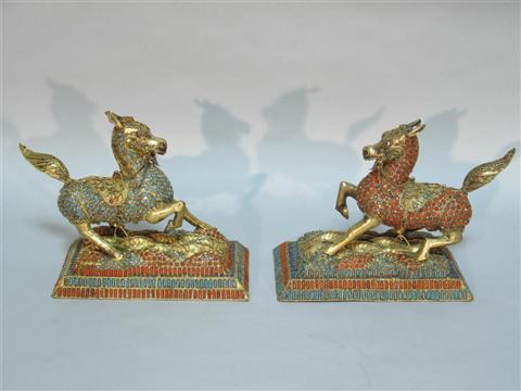 Appraisal: PAIR OF SINO-TIBETAN MODELS OF BIXIE The caparisioned mythical beasts