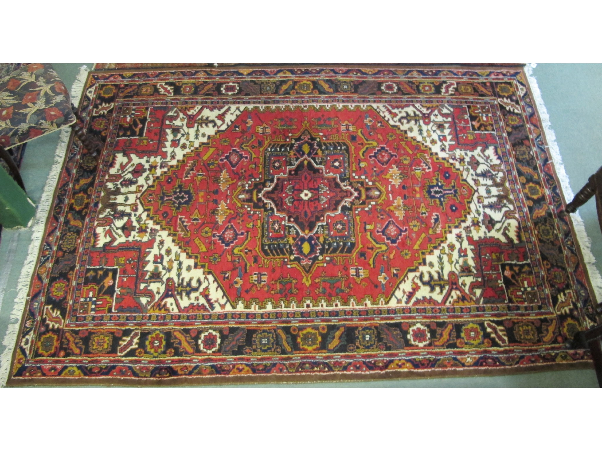 Appraisal: A Muni Hariz rust ground rug x cm