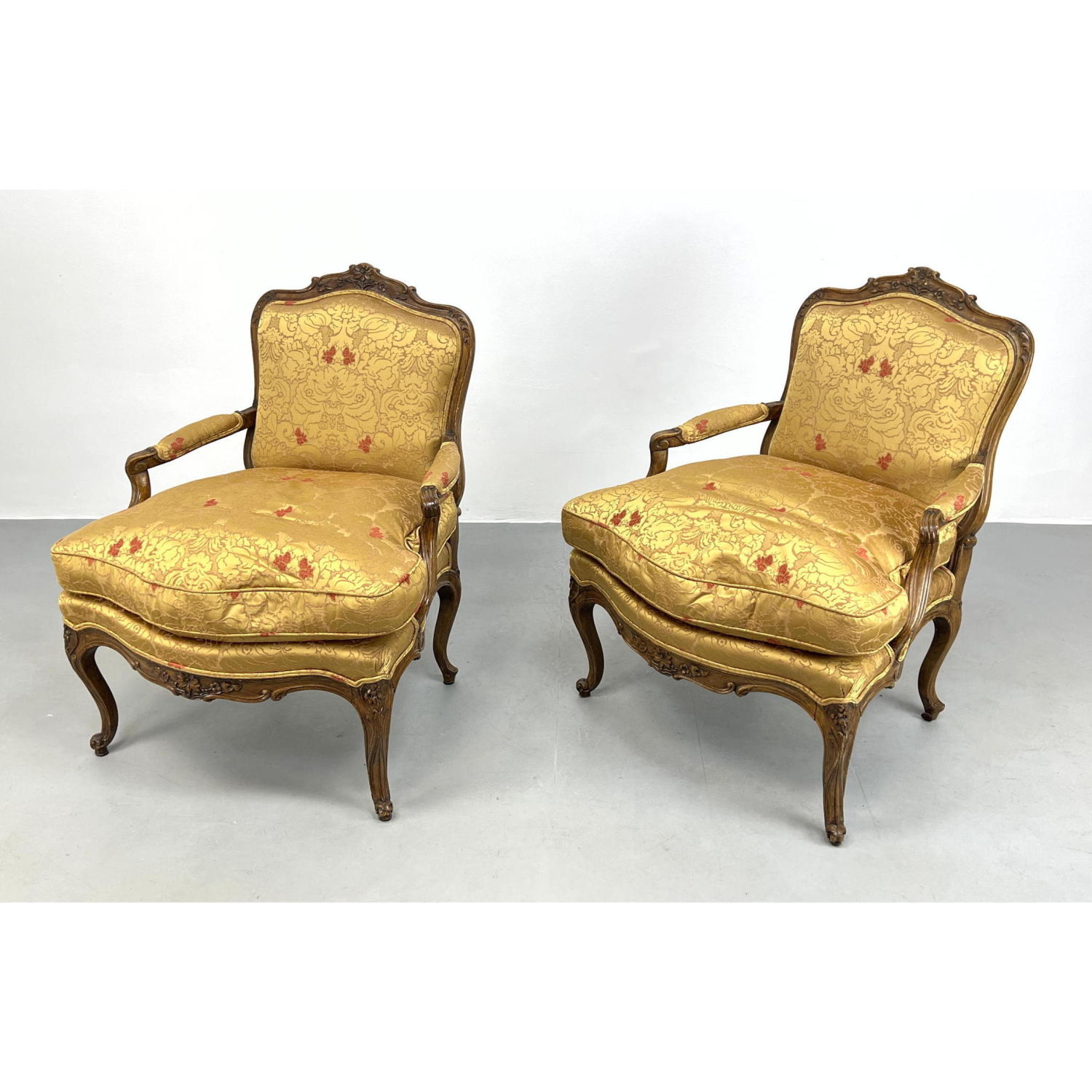 Appraisal: Pr French style Fauteuil Arm Chairs Carved Wood Frames Gold