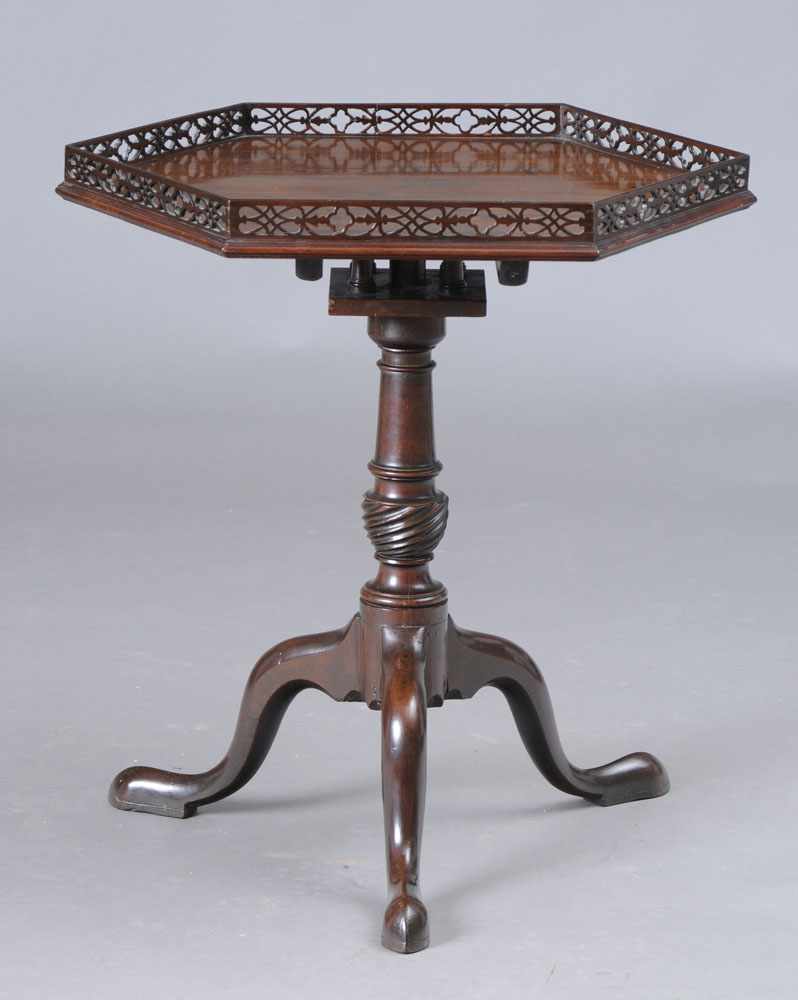 Appraisal: GEORGE III STYLE MAHOGANY HEXAGONAL TILT TOP TABLE The galleried