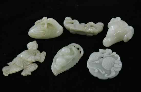 Appraisal: A group of six Chinese celadon green jade carvings comprising