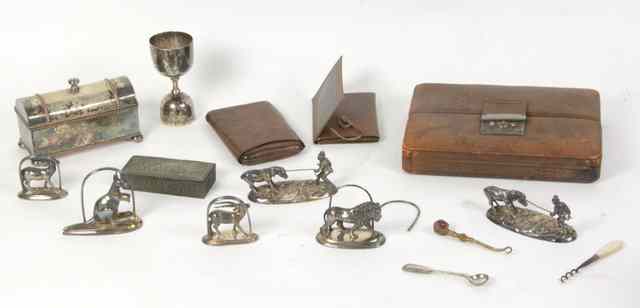 Appraisal: A set of plated menu holders modelled as animals and