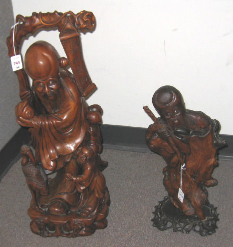 Appraisal: TWO ASIAN CARVED WOODEN IMMORTALS Both full figures of a