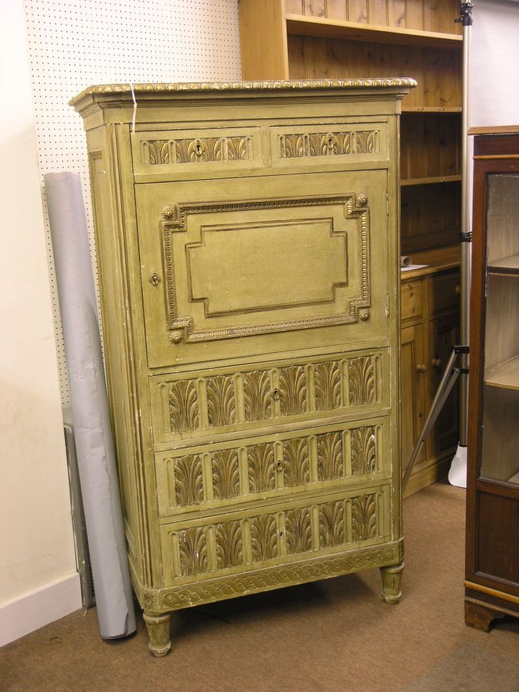 Appraisal: A French painted cupboard with carved and gilded detail two