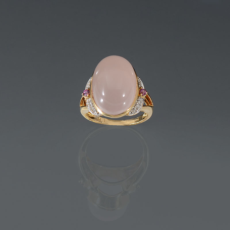 Appraisal: K CABOCHON MOONSTONE DIAMOND RING K yellow gold ring contains