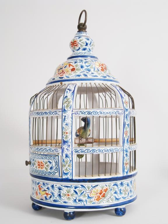 Appraisal: A French faience circular Bird Cage with all over floral