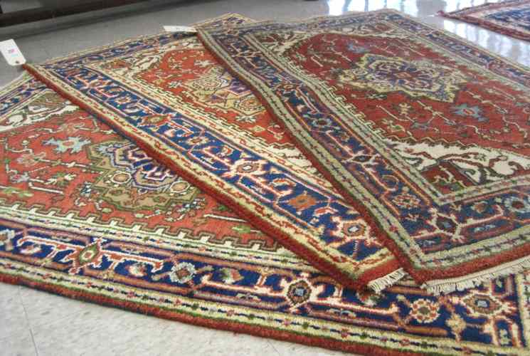 Appraisal: THREE ORIENTAL AREA RUGS Persian Serapi design all hand knotted