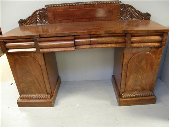 Appraisal: th century mahogany pedestal sideboard raised back carved with gadrooning