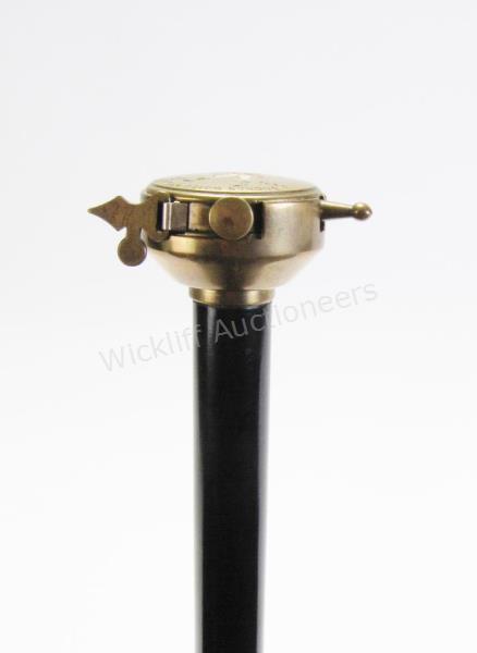 Appraisal: Advertising Tape Measure Cane solid ebony shaft topped with a