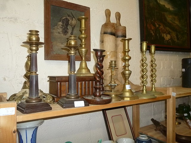 Appraisal: A PAIR OF BAKELITE AND BRASS CANDLESTICKS with fluted column