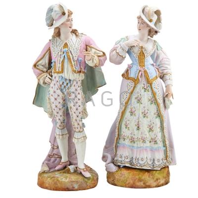 Appraisal: PAIR OF HAND-PAINTED BISQUE FIGURES Man and woman in formal