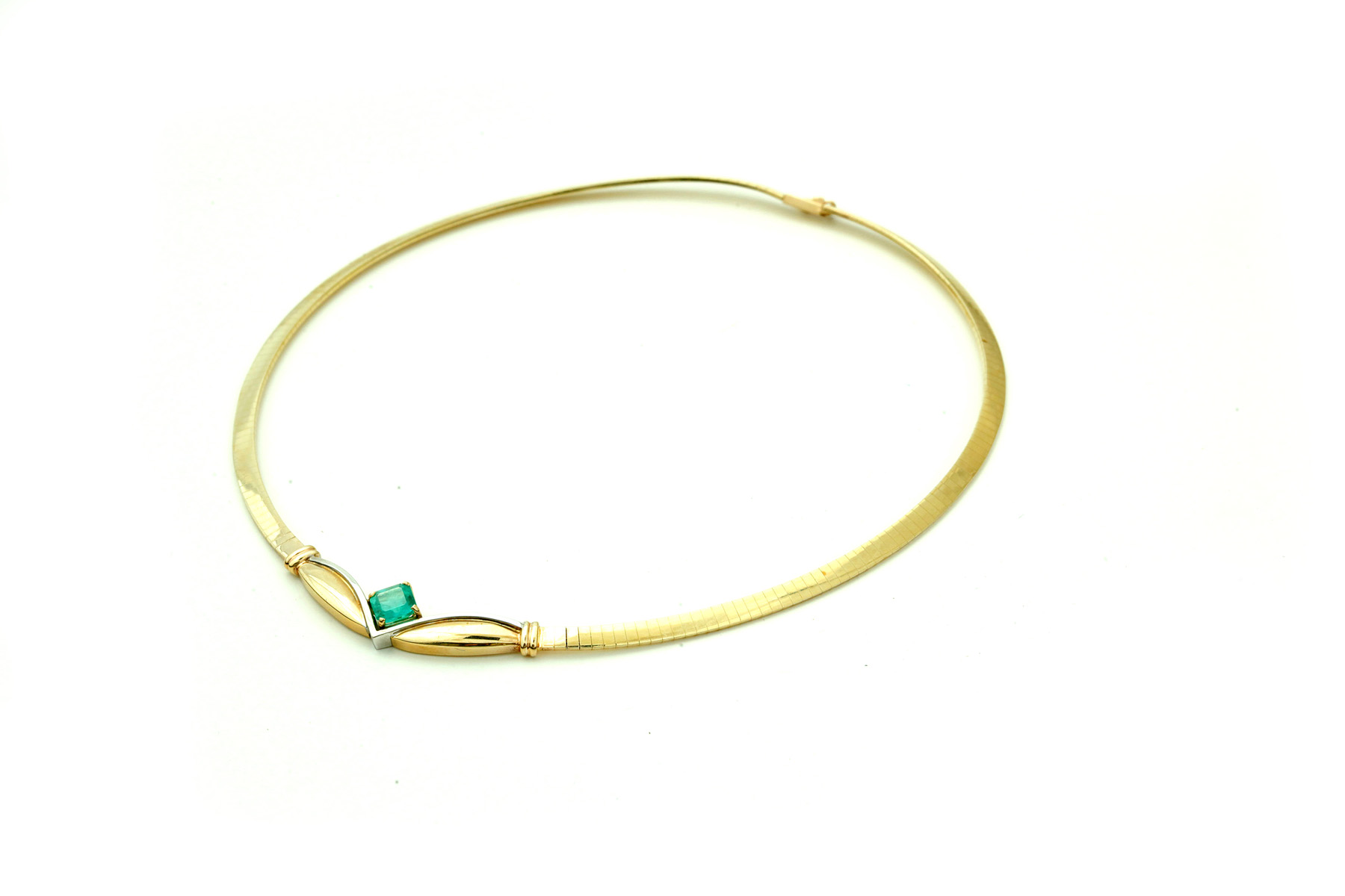 Appraisal: GOLD OMEGA NECKLACE WITH EMERALD American th century k yellow