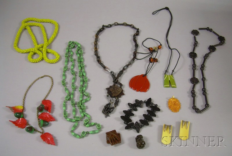 Appraisal: Group of Bakelite and Plastic Jewelry including a carved floral